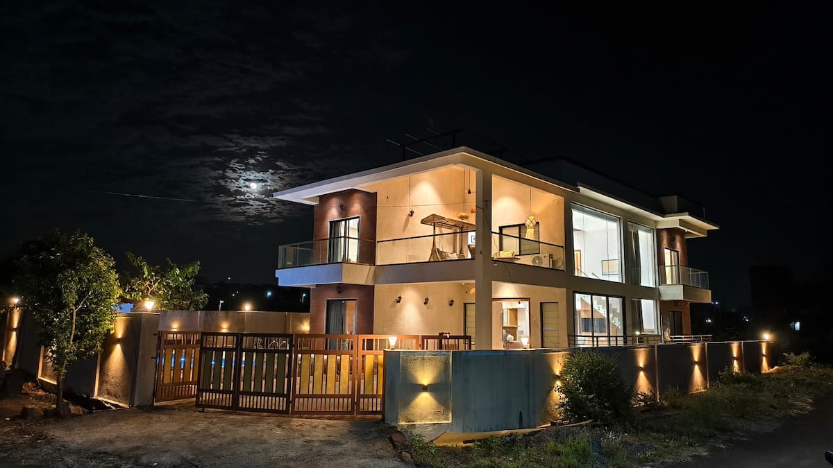 Aurai Villa exterior with pool and sea view